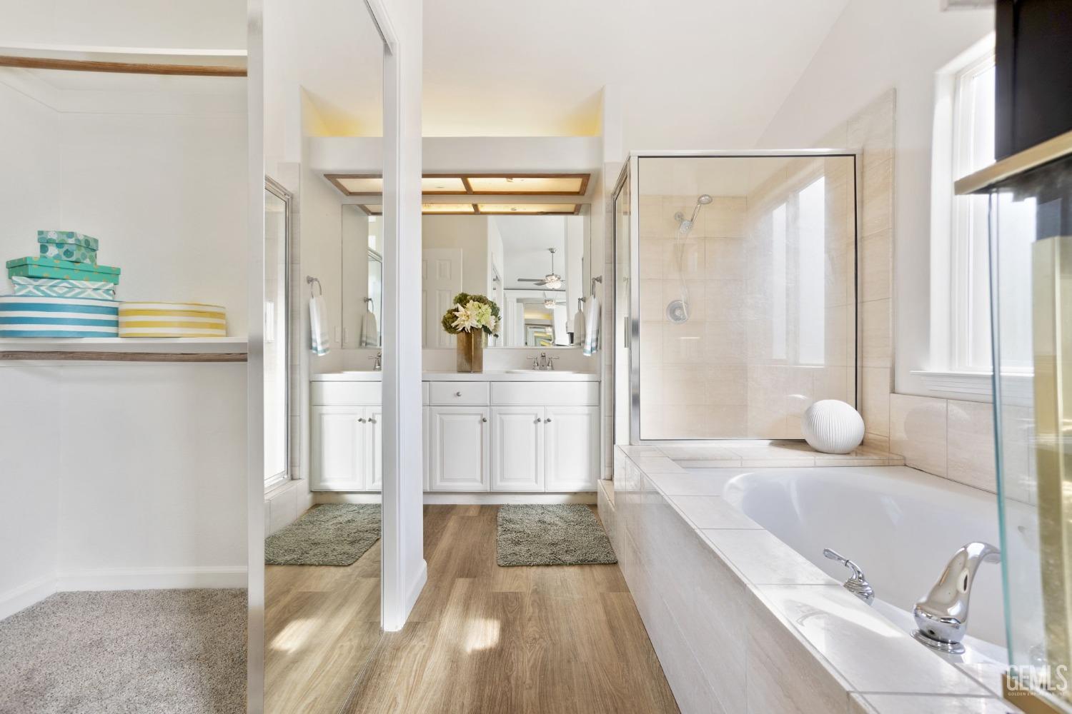 Undisclosed Address Bakersfield, CA 93311 - Photo 41 of 52 a bathroom with a tub shower and sink