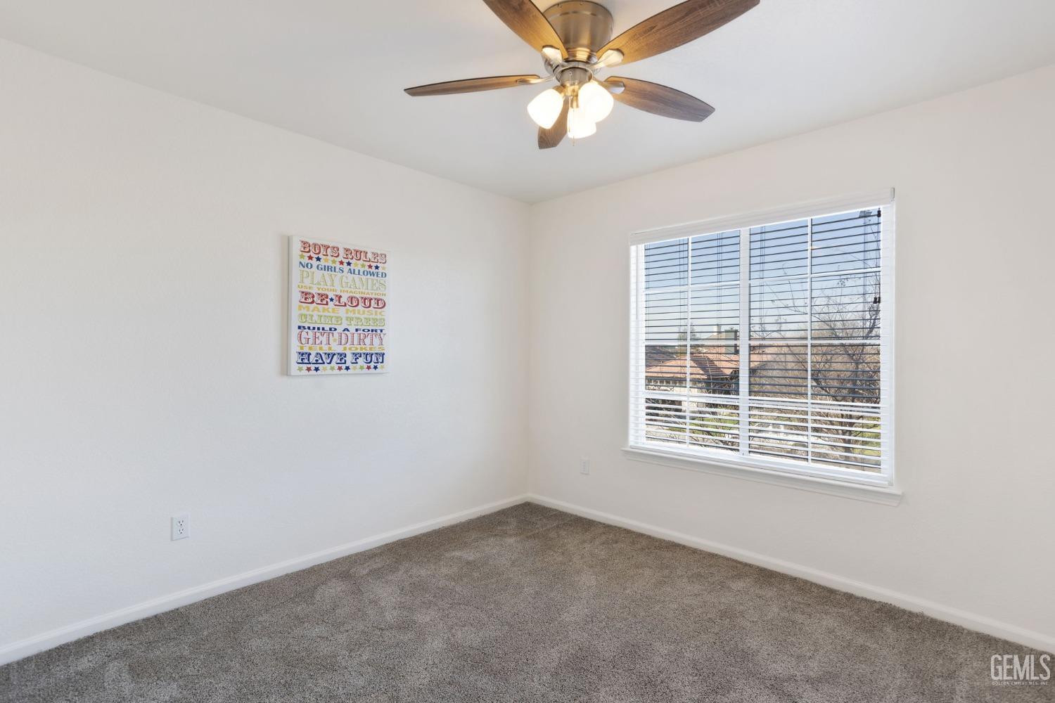 Undisclosed Address Bakersfield, CA 93311 - Photo 42 of 52 an empty room with windows and fan