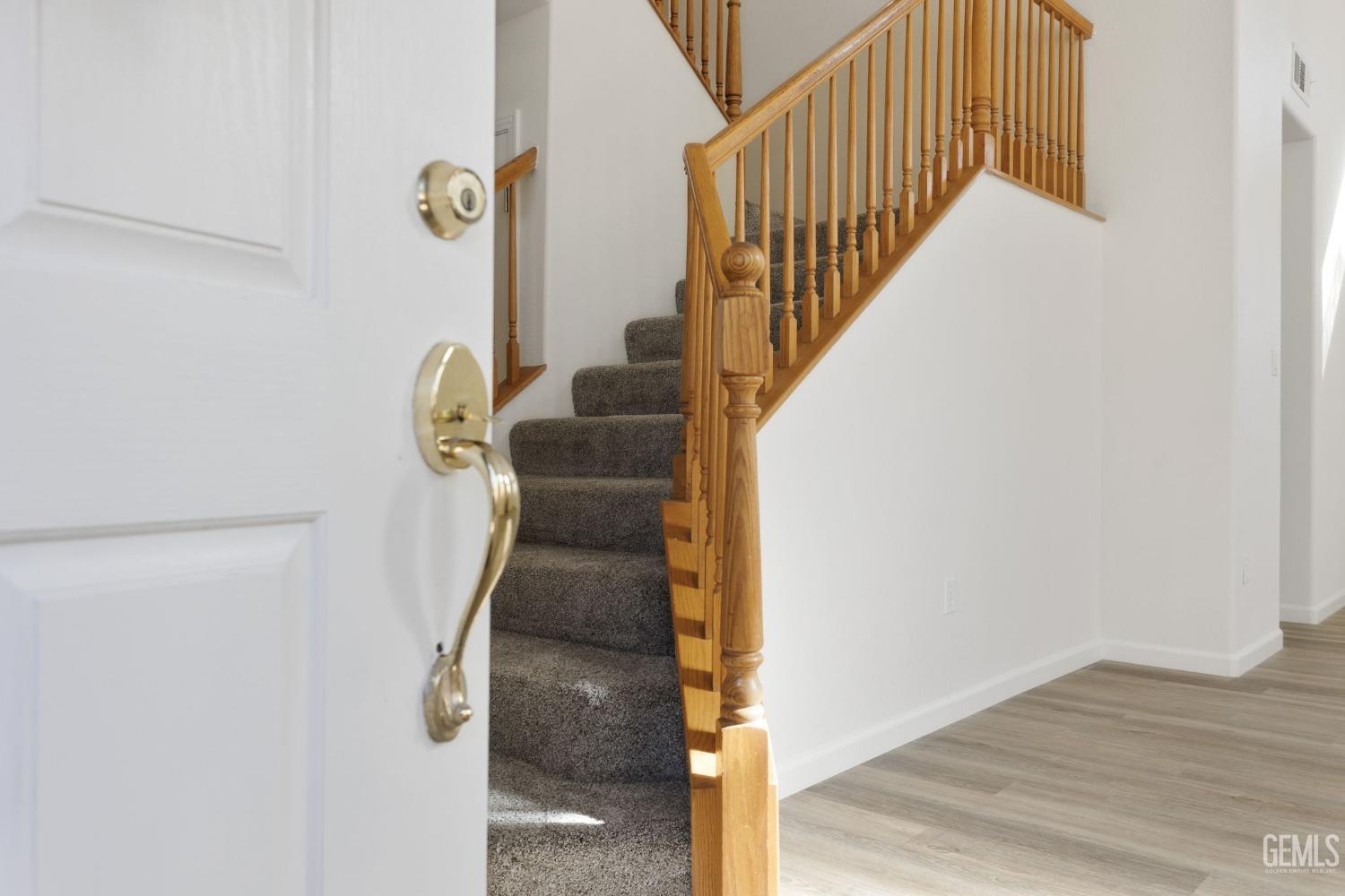 Undisclosed Address Bakersfield, CA 93311 - Photo 6 of 52 a view of entryway and hall with wooden floor