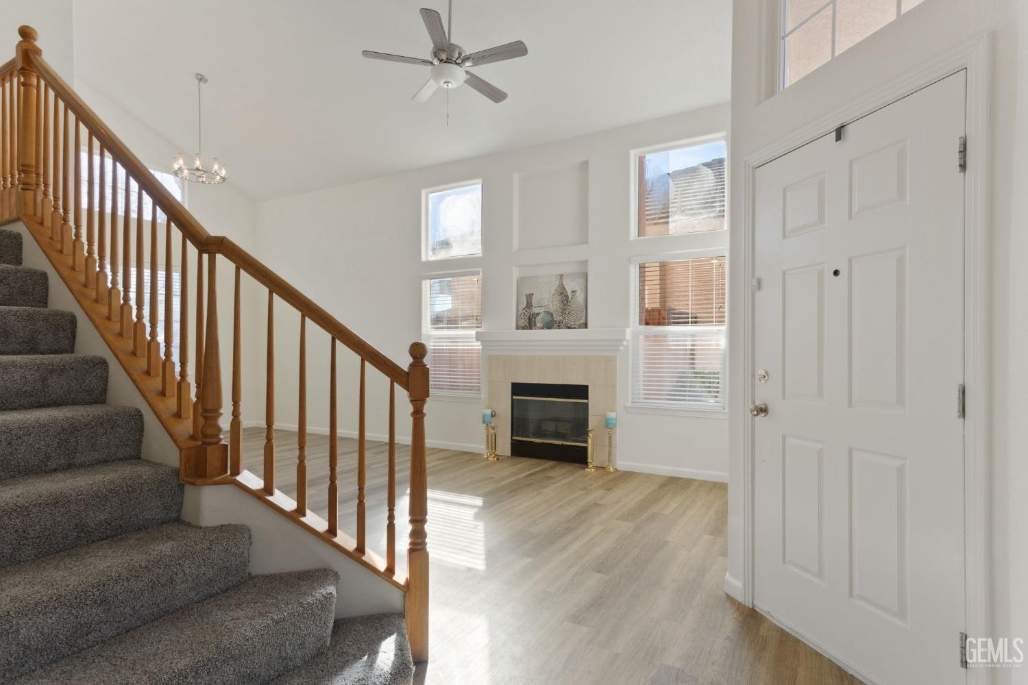 Undisclosed Address Bakersfield, CA 93311 - Photo 7 of 52 a view of a livingroom with a staircase