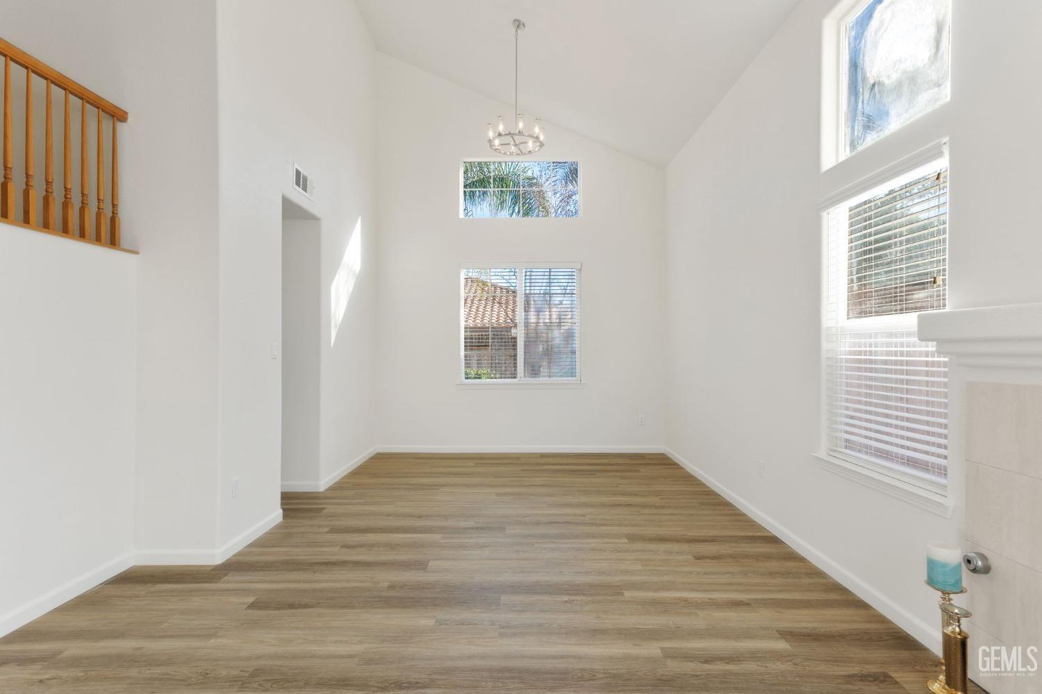 Undisclosed Address Bakersfield, CA 93311 - Photo 10 of 52 a view of empty room with window and wooden floor