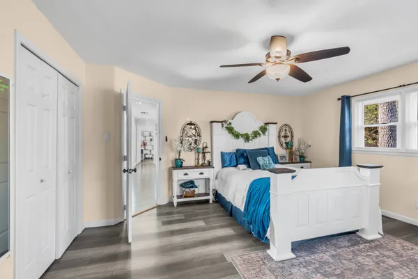 a bed room with a bed and a chandelier