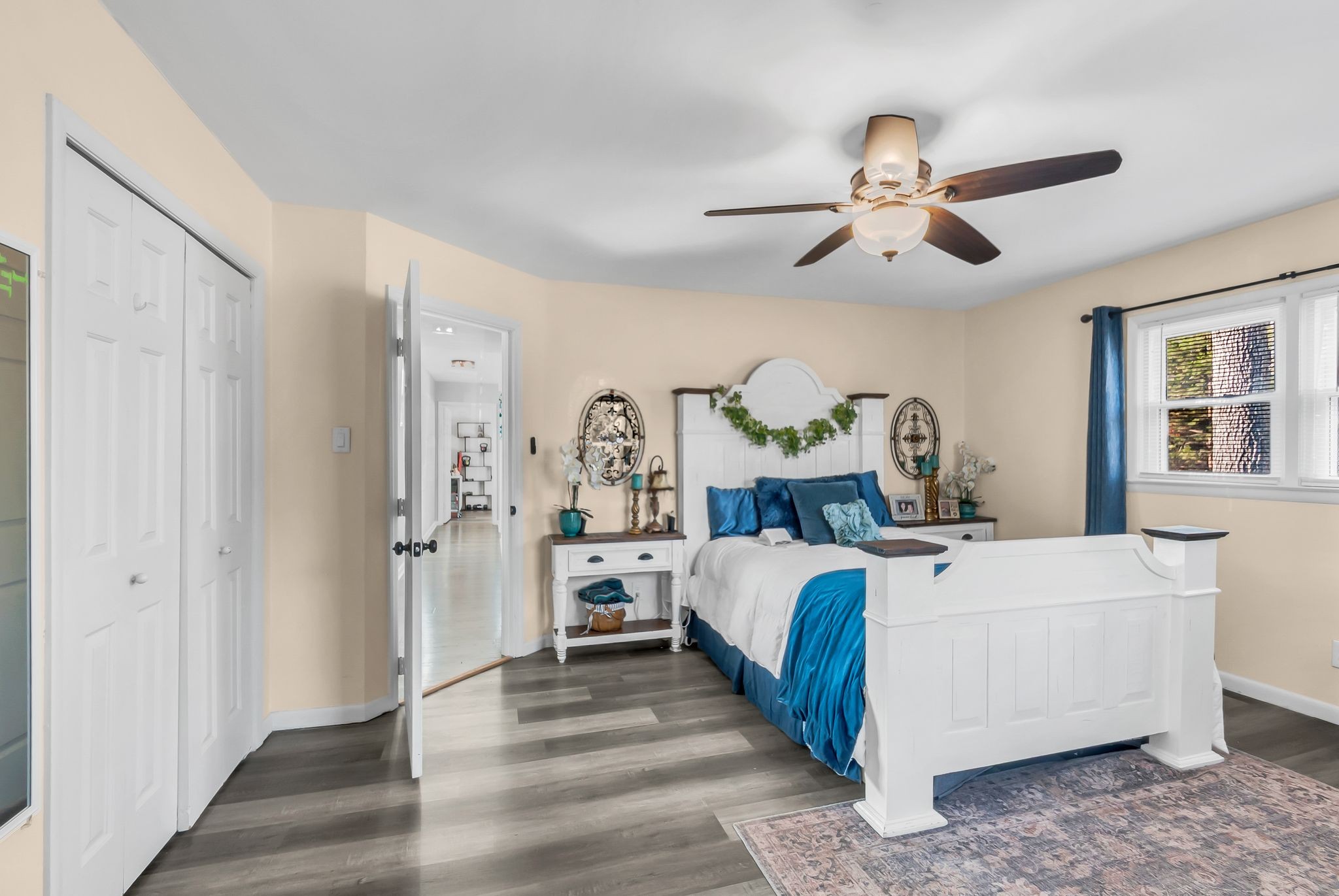 1005 Boyd Street Belfast, TN 37019 - Photo 13 of 24 a bed room with a bed and a chandelier