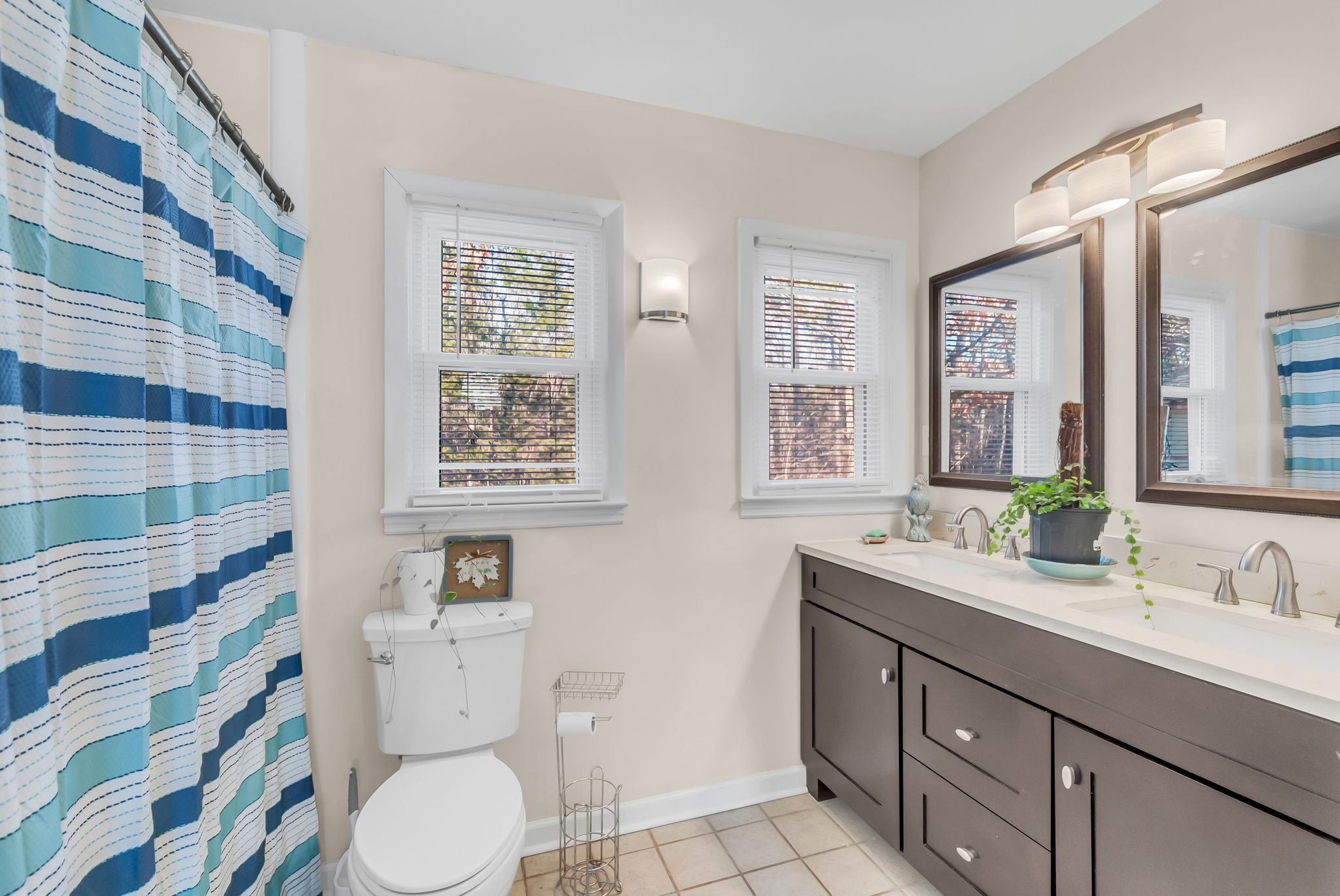 1005 Boyd Street Belfast, TN 37019 - Photo 16 of 24 a bathroom with a granite countertop toilet sink and mirror