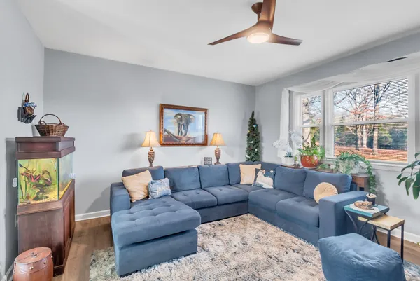 a living room with furniture and a large window