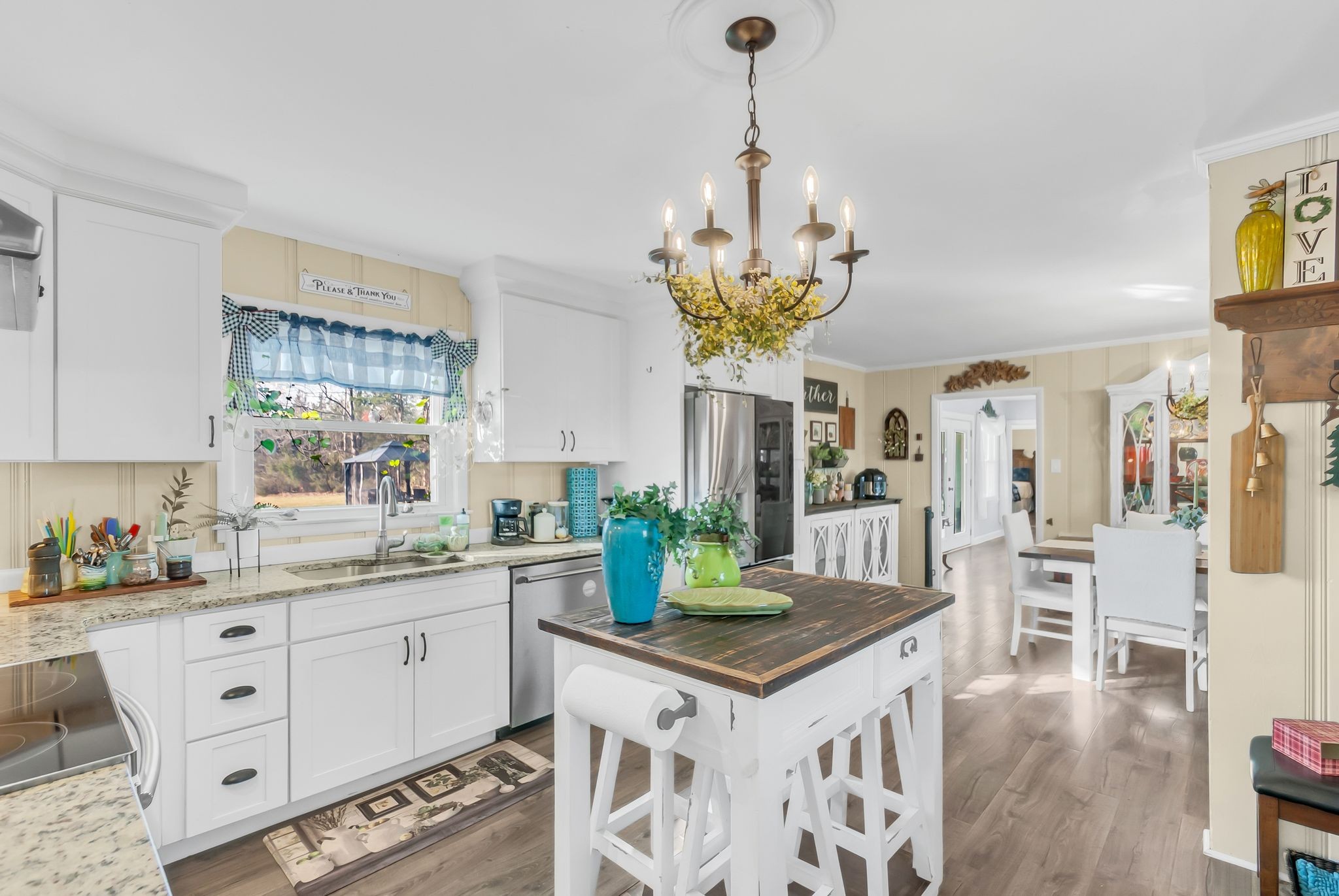 1005 Boyd Street Belfast, TN 37019 - Photo 3 of 24 a kitchen with stainless steel appliances a sink a stove refrigerator and chandelier