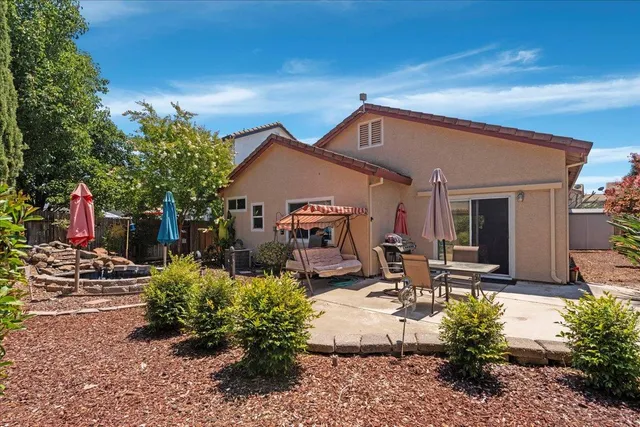 a front view of a house with sitting area