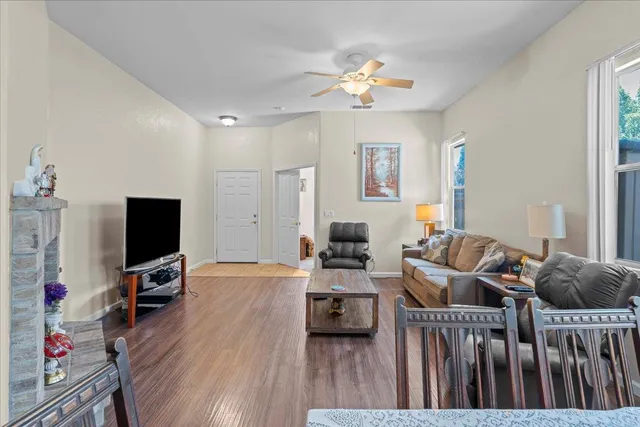 a living room with furniture and a flat screen tv
