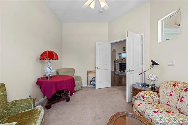 a bedroom with furniture and a window
