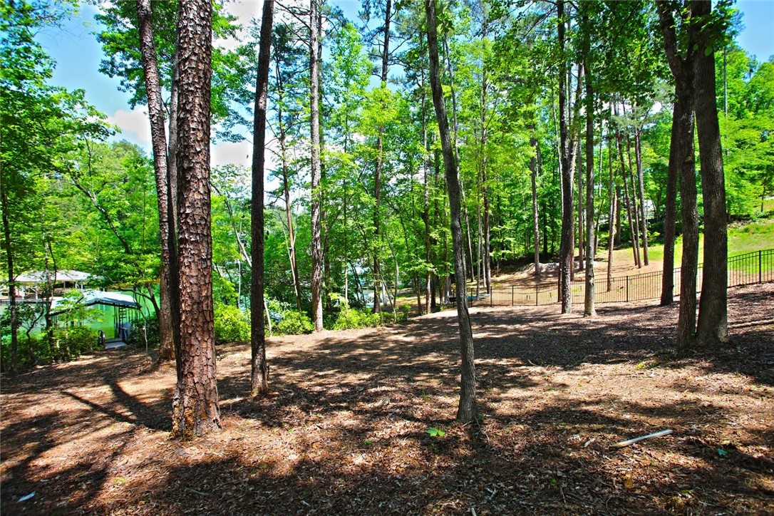 Lot 114 Harbor Point Seneca, SC 29672 - Photo 33 of 46 This lot offers a natural, wooded setting with convenient waterfront access and a private fence.