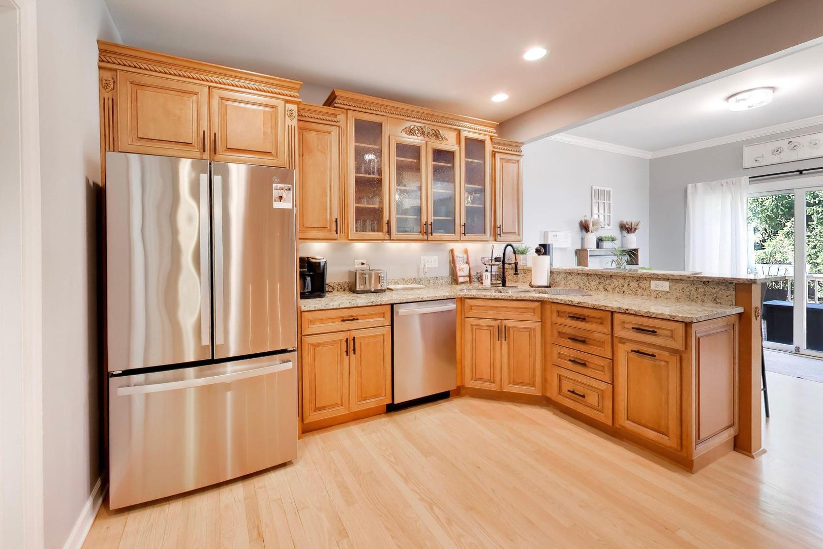 741 Juniper Lane Lake In The Hills, IL 60156 - Photo 11 of 43 a kitchen with a refrigerator and a sink