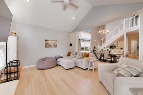 a living room with furniture window and wooden floor