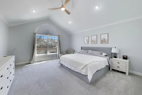 a bedroom with a bed and a couch
