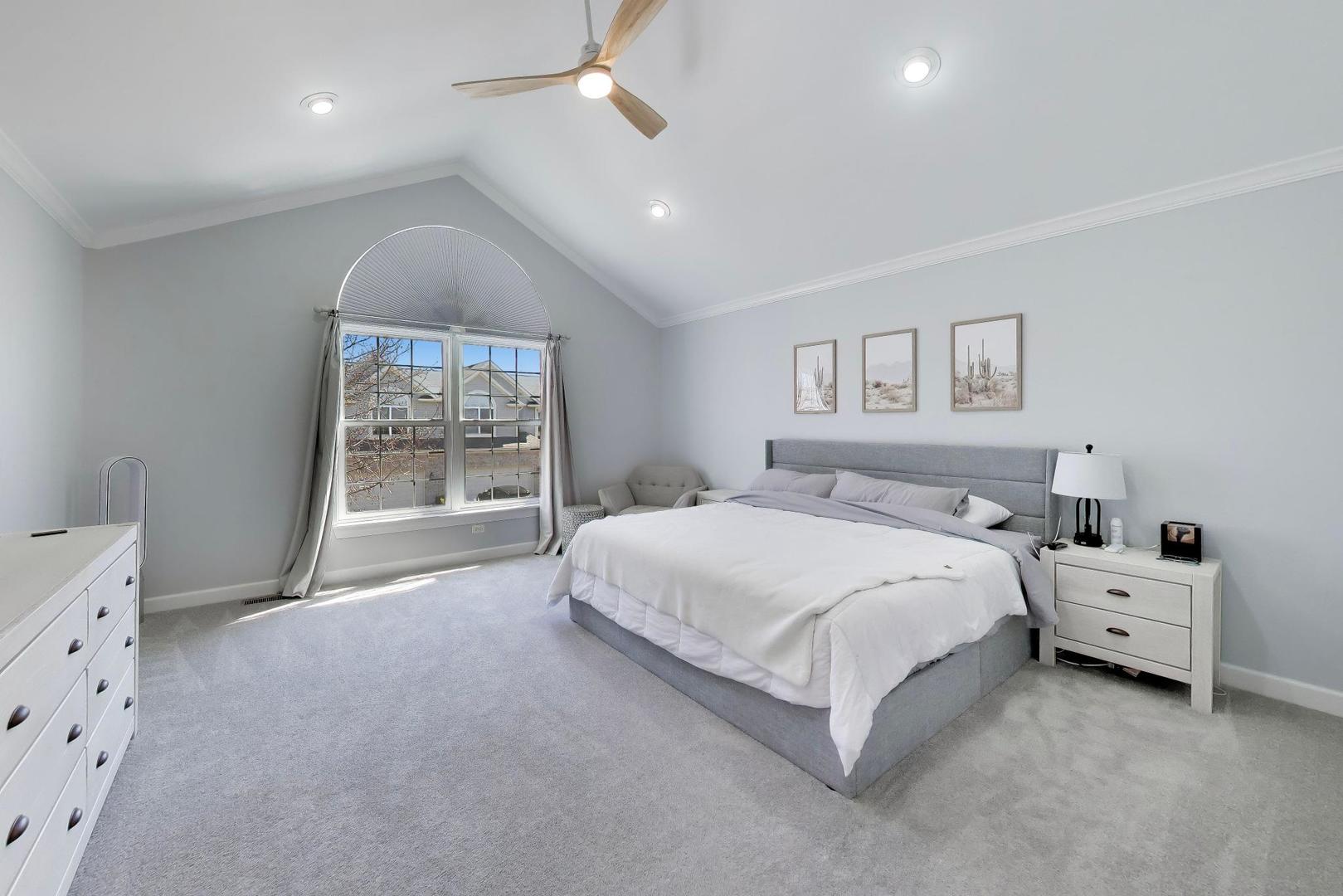 741 Juniper Lane Lake In The Hills, IL 60156 - Photo 21 of 43 a spacious bedroom with a bed and a window