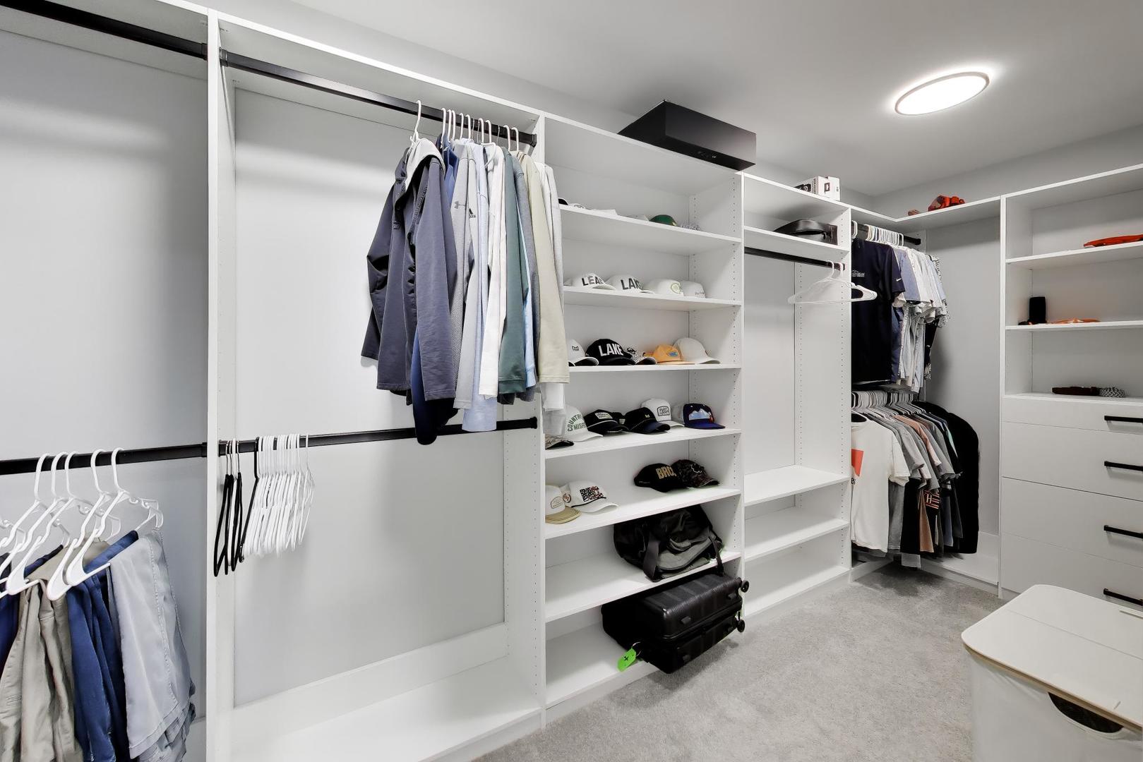 741 Juniper Lane Lake In The Hills, IL 60156 - Photo 23 of 43 a view of walk in closet with clothes and shoes