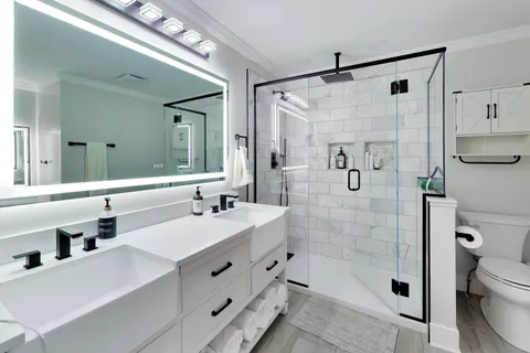 a bedroom with a bed and flat screen tv