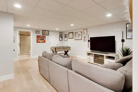 a living room with furniture and a rug