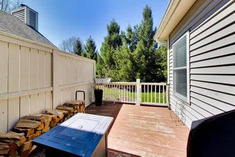 a view of a two chairs in the balcony