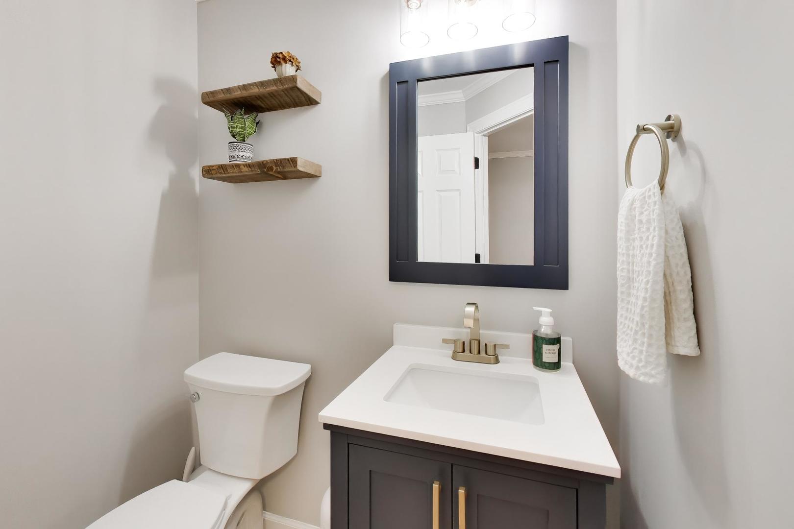 741 Juniper Lane Lake In The Hills, IL 60156 - Photo 8 of 43 a bathroom with a sink toilet and mirror