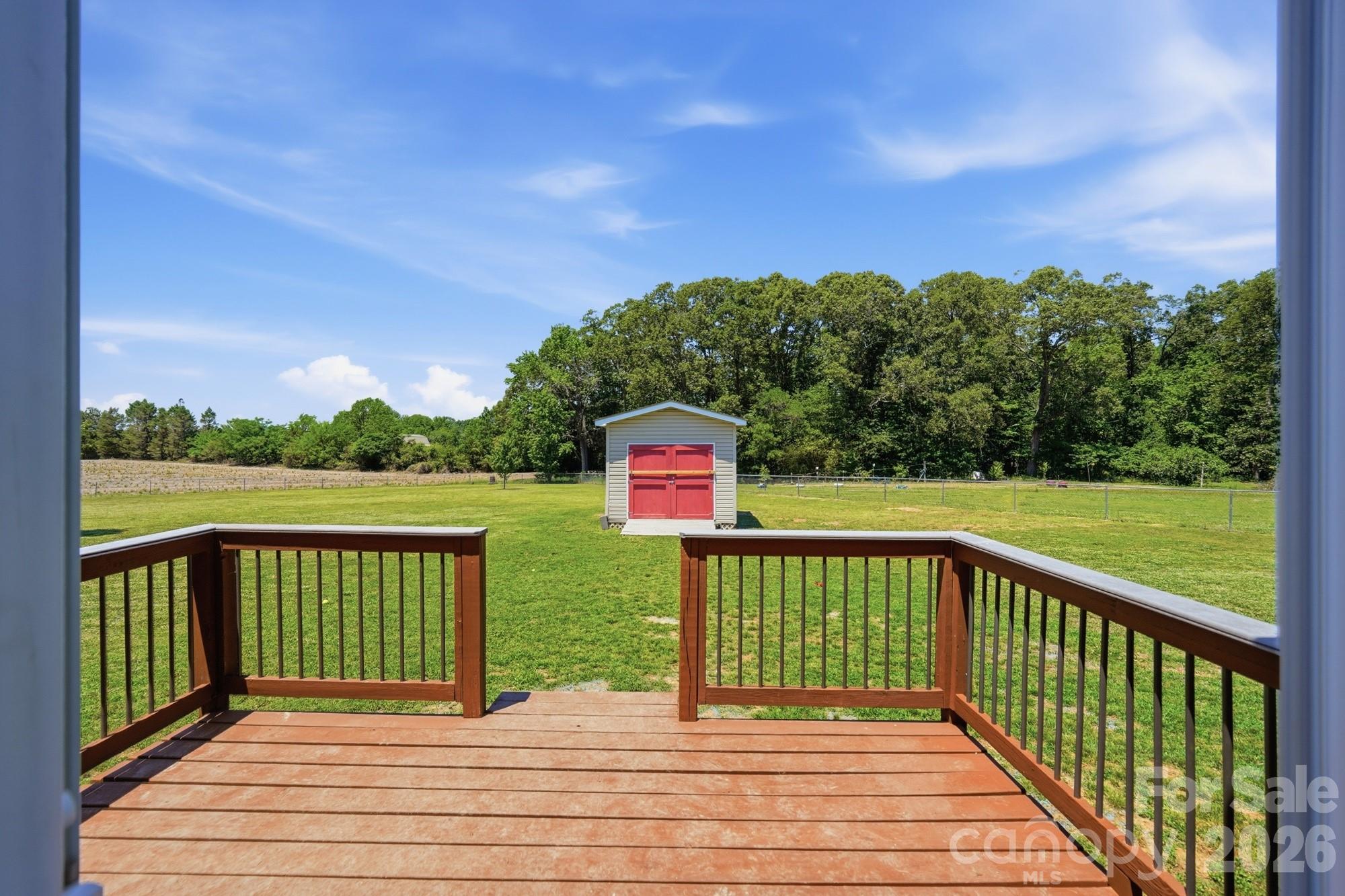 4415 Old Monroe Marshville Road Wingate, NC 28174 - Photo 22 of 28 a view of a deck with a yard