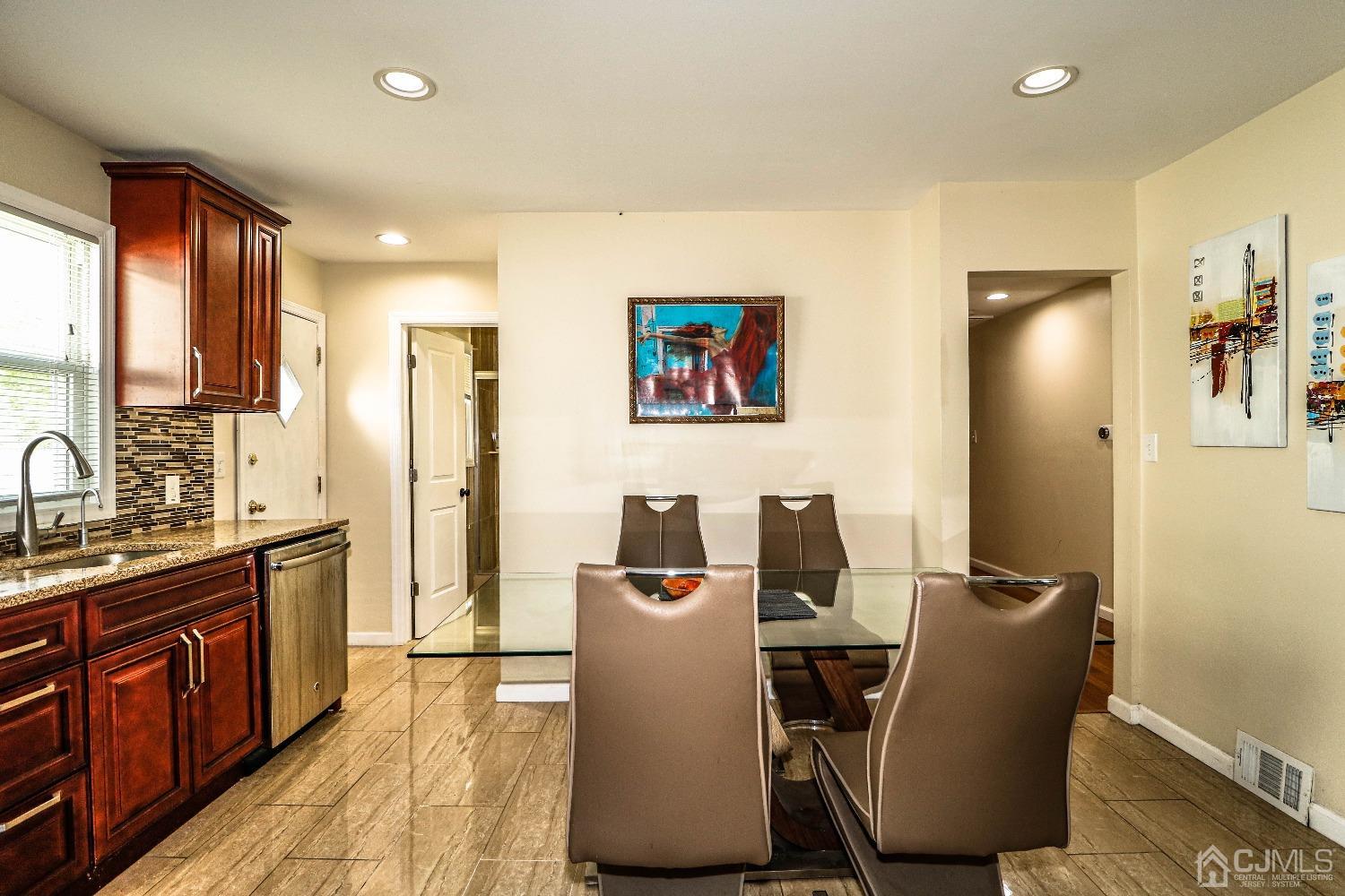 198 Carter Road Princeton, NJ 08540 - Photo 13 of 38 a view of a kitchen with fridge and wooden floor