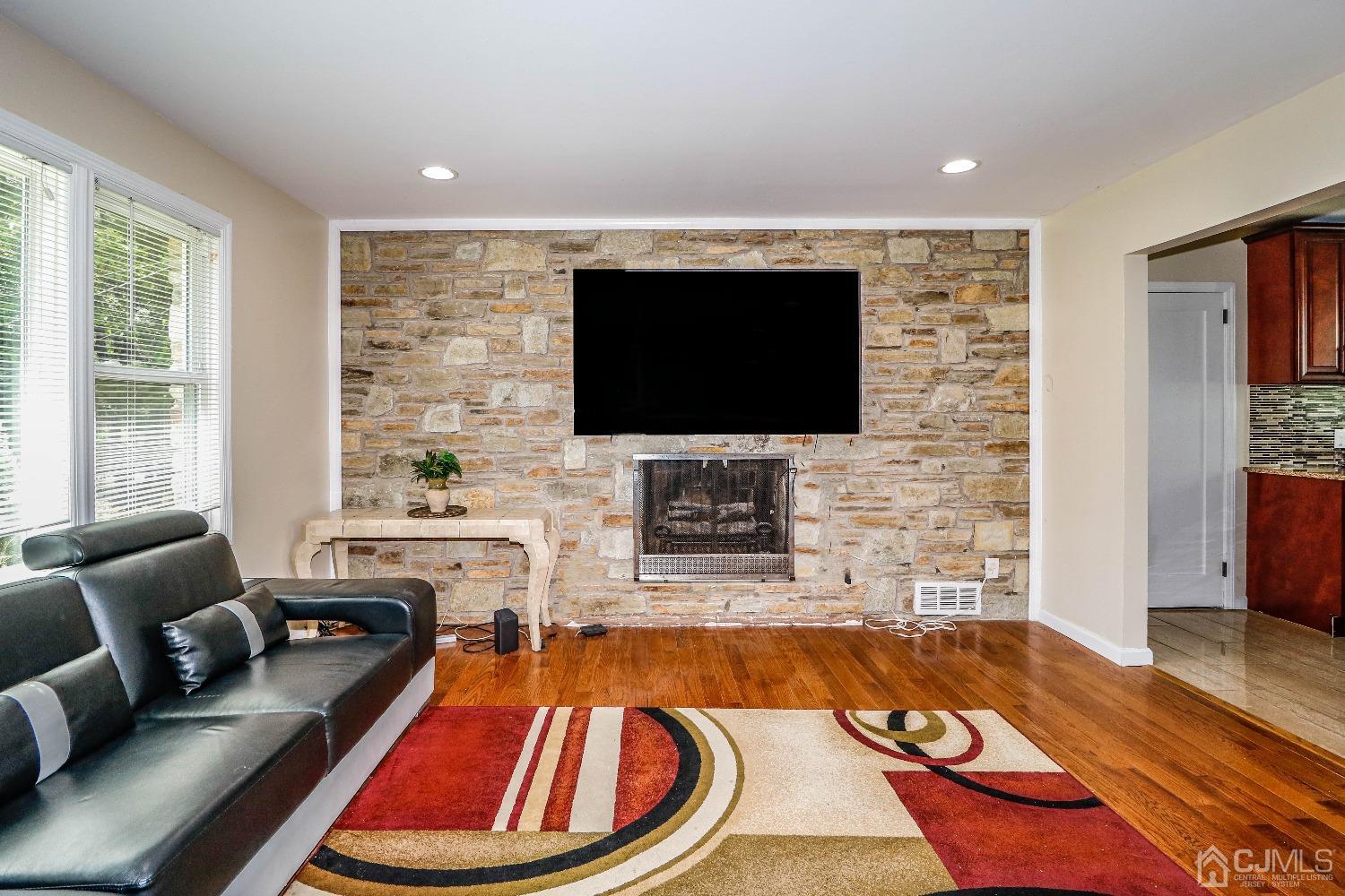 198 Carter Road Princeton, NJ 08540 - Photo 2 of 38 a living room with fireplace furniture and a flat screen tv