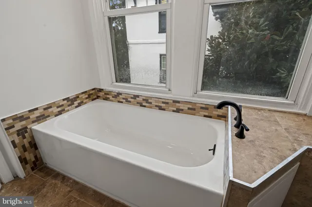 a close view of a bathtub in bathroom