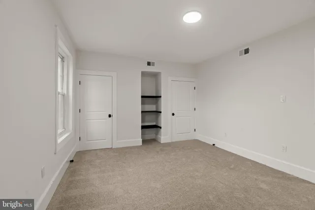 an empty room with a closet