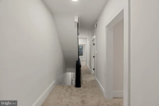a view of a hallway with hallway and stairs