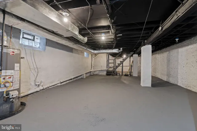 front view of a brick house with a yard