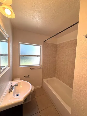 a bathroom with a sink and a bathtub