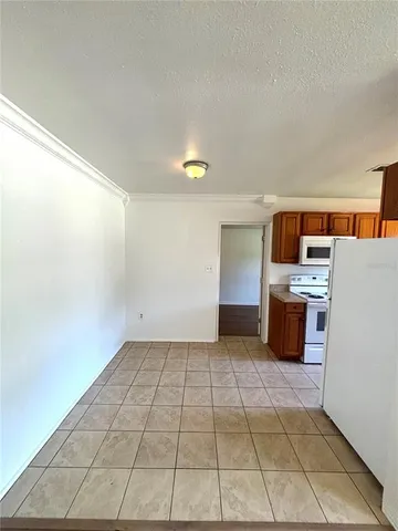 a kitchen with stainless steel appliances a stove a sink and a refrigerator