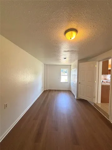 an empty room with a empty space and window