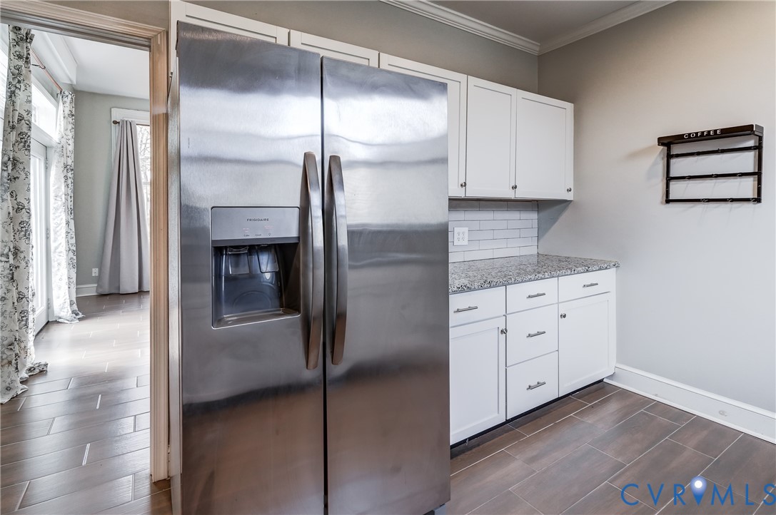 418 4th Street West Point, VA 23181 - Photo 15 of 36 a kitchen with white cabinets and refrigerator