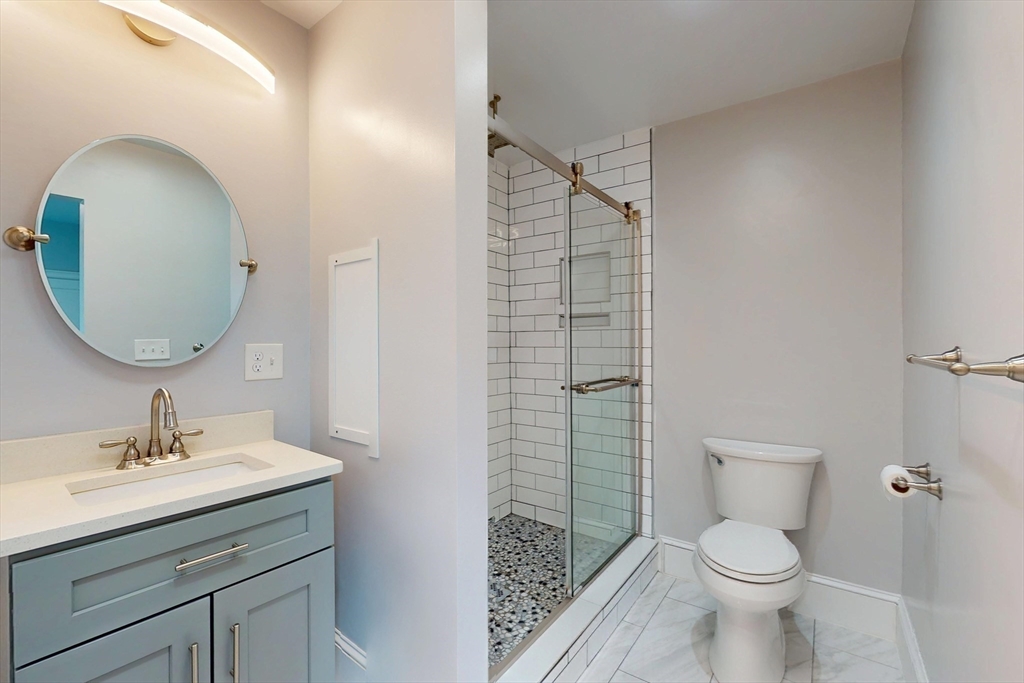 61 Charlotte Street, Unit 2 Boston, MA 02121 - Photo 19 of 36 a bathroom with a sink toilet and shower