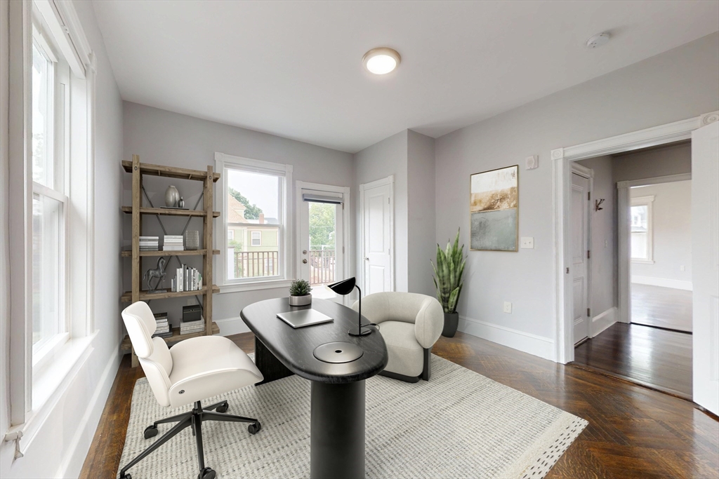61 Charlotte Street, Unit 2 Boston, MA 02121 - Photo 20 of 36 a living room with furniture and wooden floor