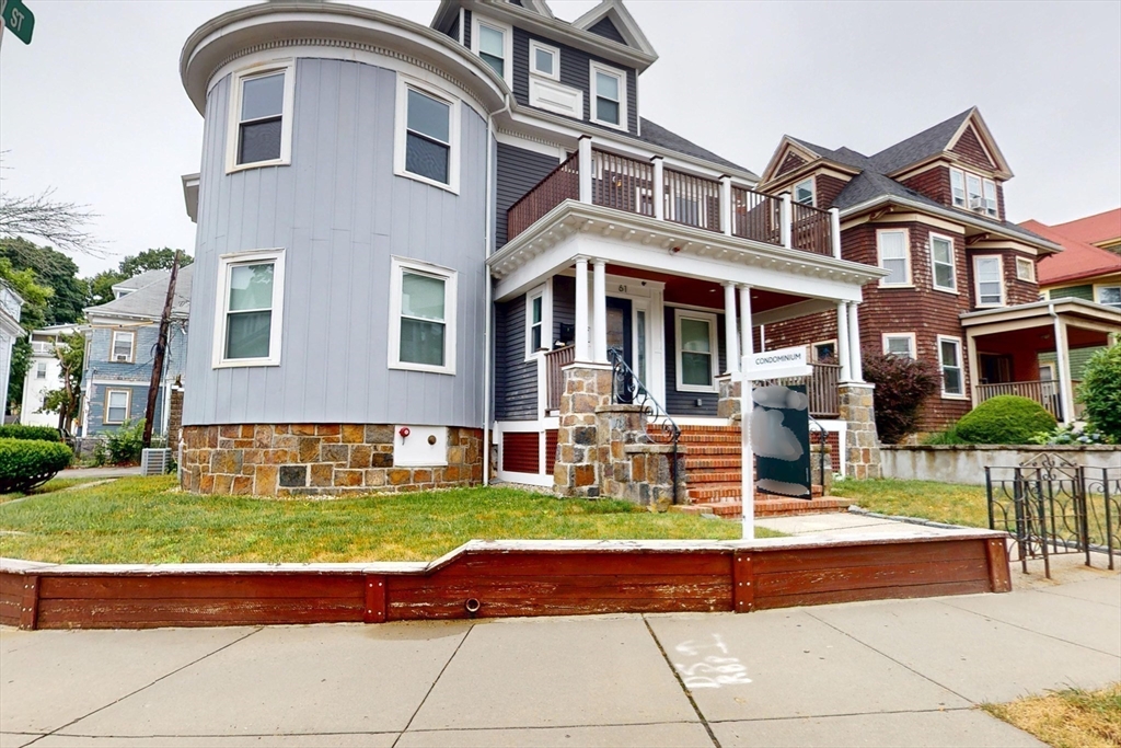 61 Charlotte Street, Unit 2 Boston, MA 02121 - Photo 28 of 36 a view of a house with swimming pool and a yard