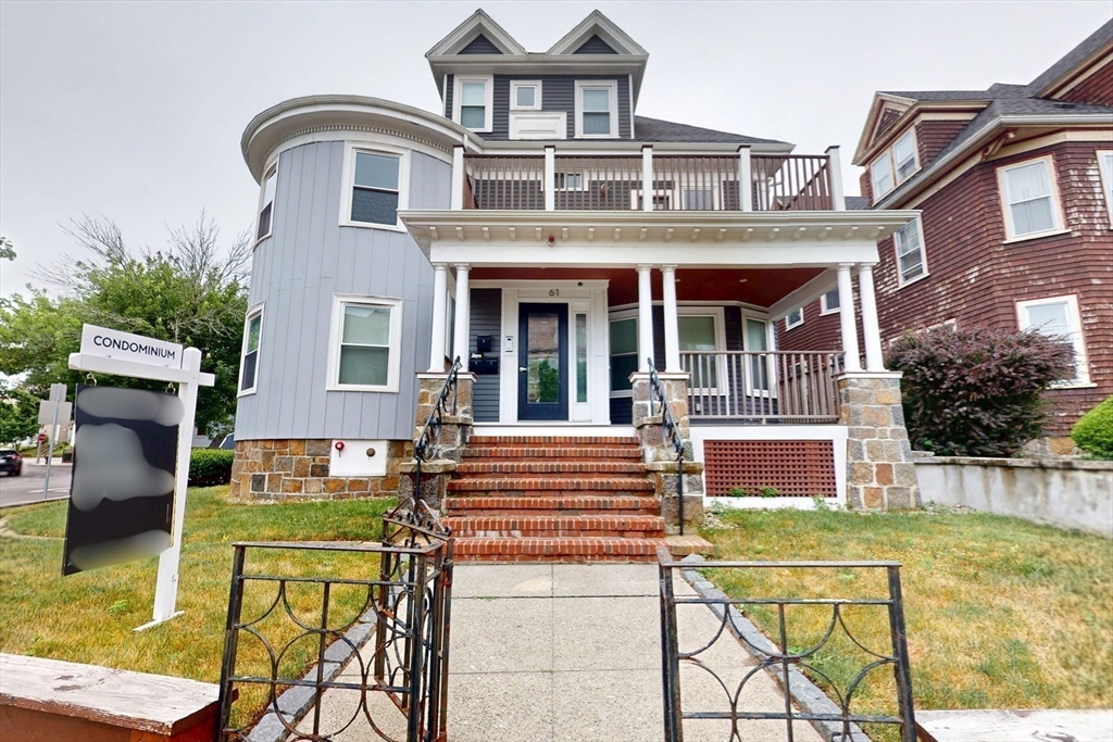 61 Charlotte Street, Unit 2 Boston, MA 02121 - Photo 29 of 36 front view of a brick house with a swimming pool