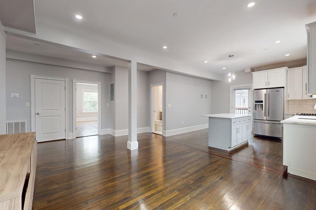 61 Charlotte Street, Unit 2 Boston, MA 02121 - Photo 7 of 36 a view of kitchen with stainless steel appliances refrigerator oven and cabinets