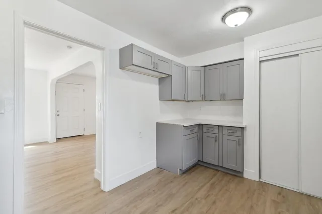 a view of cabinets and wooden floor