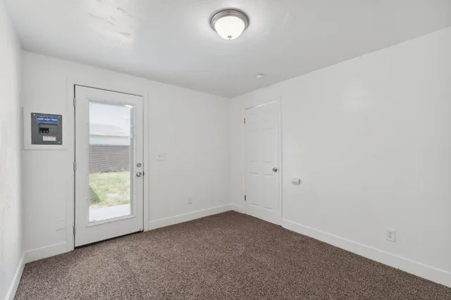 a view of an empty room with a window