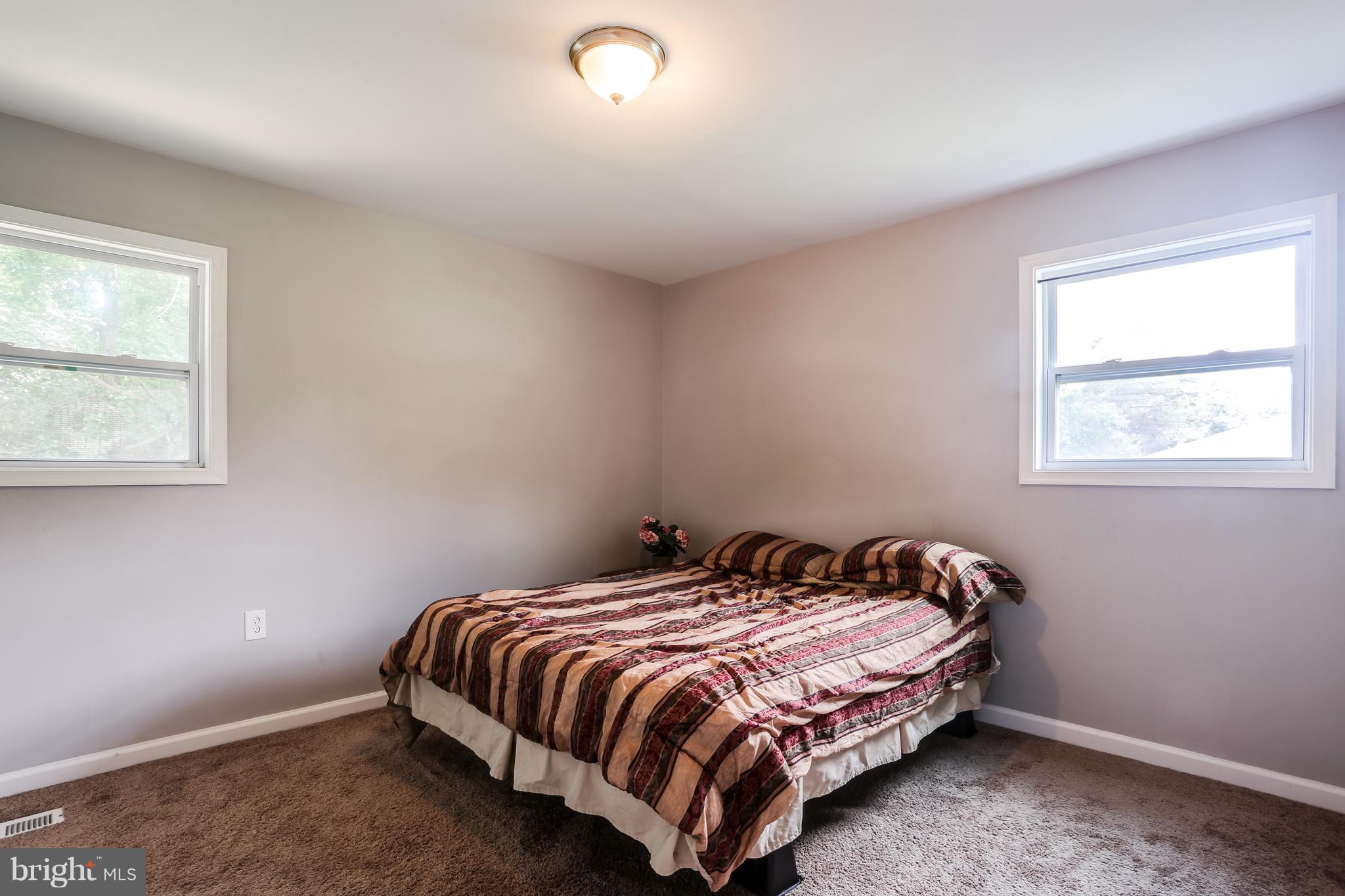 19 Millgate Road Owings Mills, MD 21117 - Photo 13 of 30 a bedroom with a bed and window