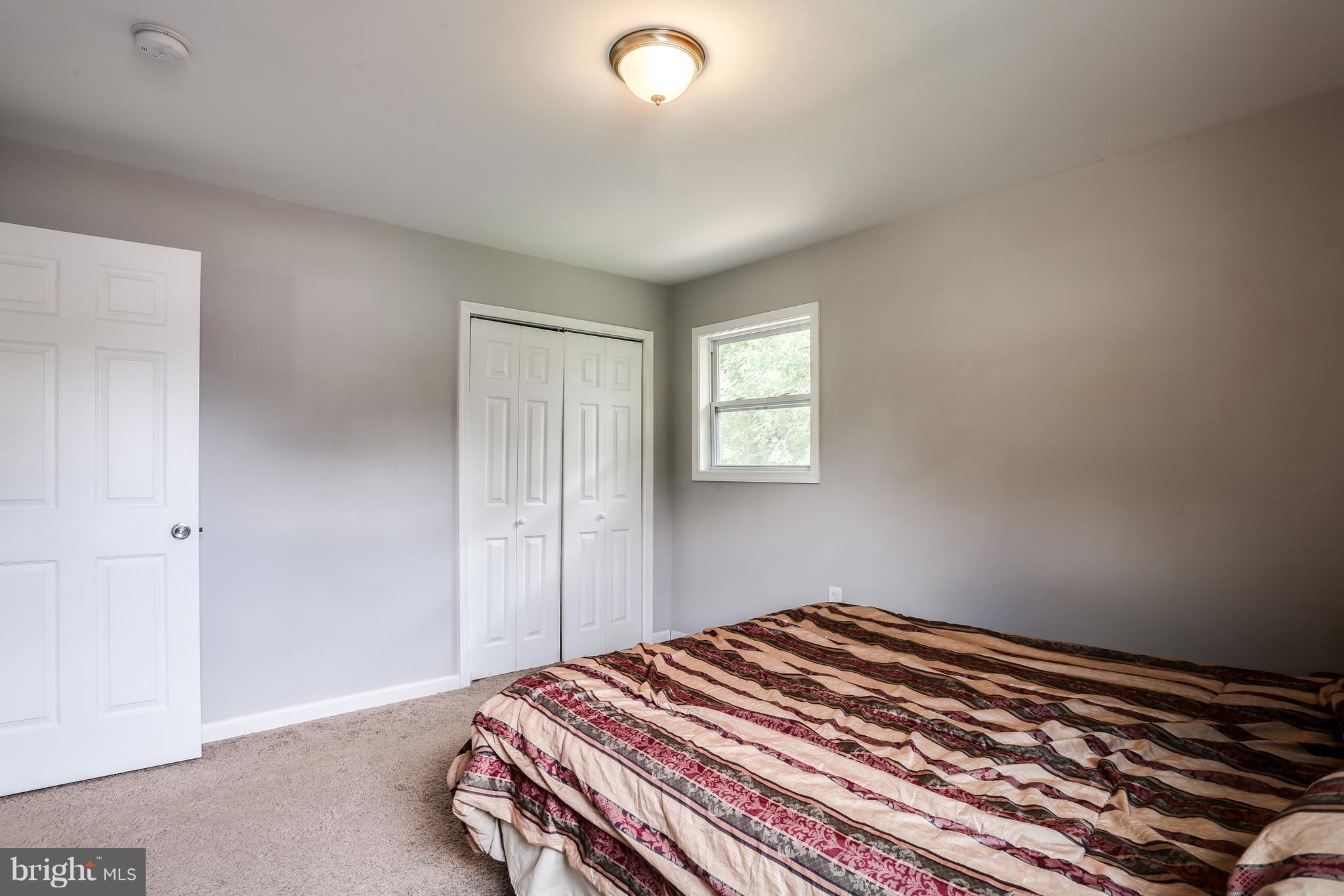 19 Millgate Road Owings Mills, MD 21117 - Photo 15 of 30 a bedroom with a bed and a window