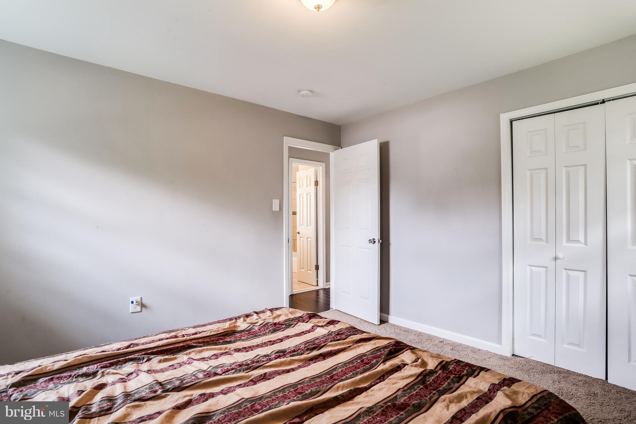 19 Millgate Road Owings Mills, MD 21117 - Photo 16 of 30 a bedroom with a bed and a window