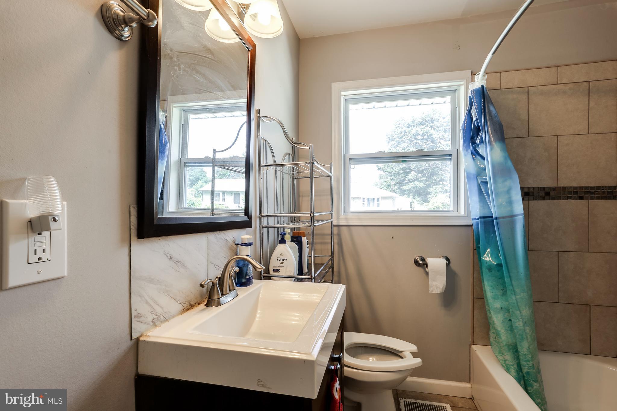 19 Millgate Road Owings Mills, MD 21117 - Photo 17 of 30 a bathroom with a sink a toilet and tub