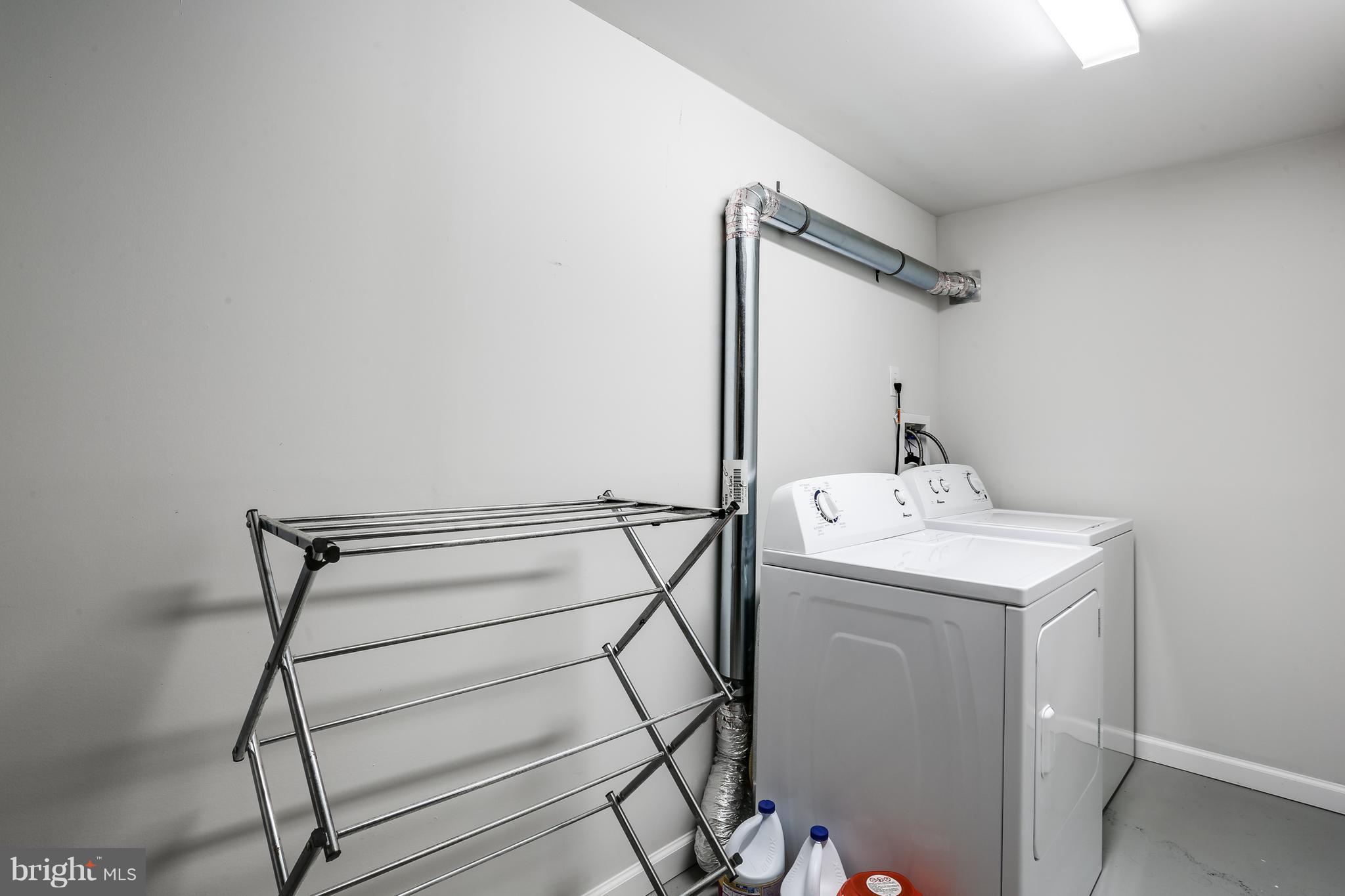 19 Millgate Road Owings Mills, MD 21117 - Photo 24 of 30 a utility room with dryer and washer