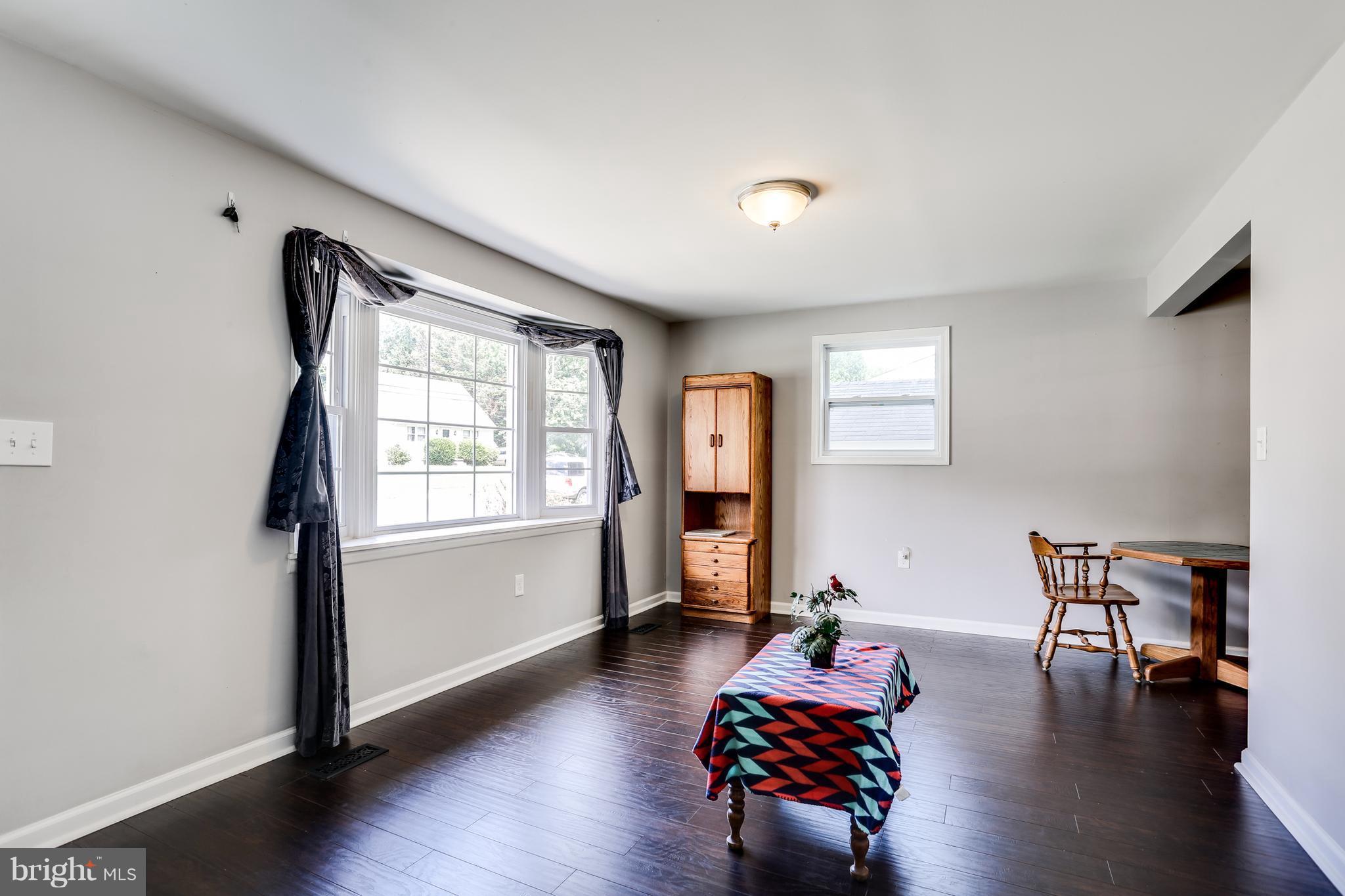 19 Millgate Road Owings Mills, MD 21117 - Photo 5 of 30 a living room with furniture and wooden floor