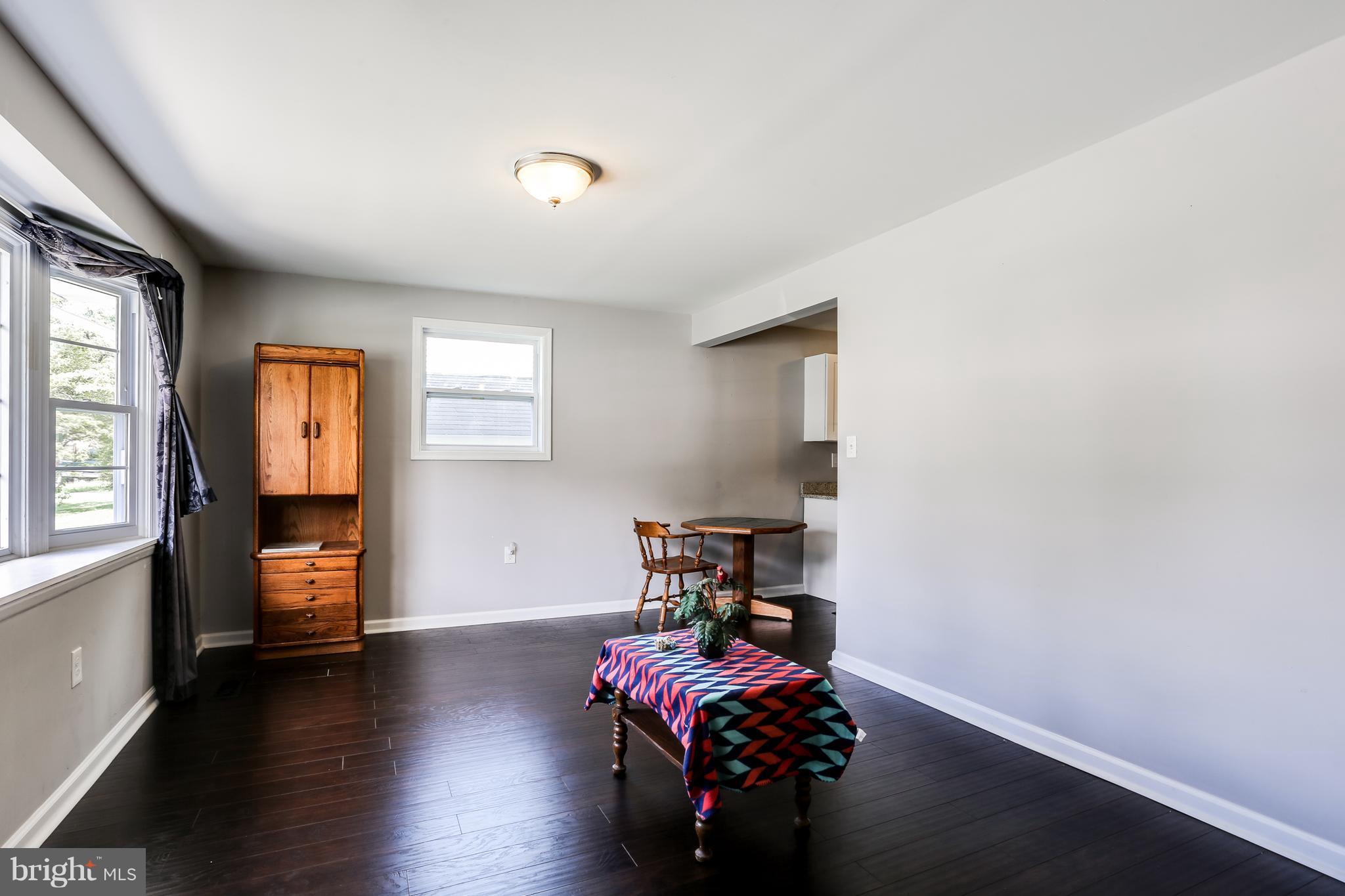 19 Millgate Road Owings Mills, MD 21117 - Photo 7 of 30 a bedroom with a bed and wooden floor