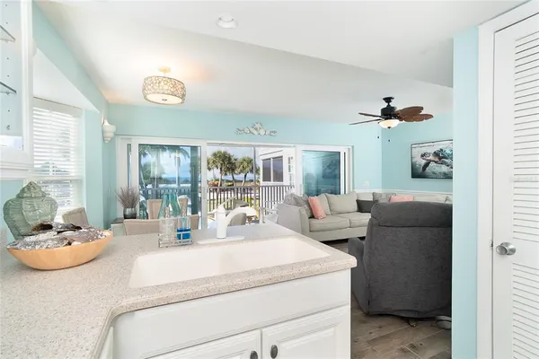 a view of a dining room with furniture wooden floor and a chandelier