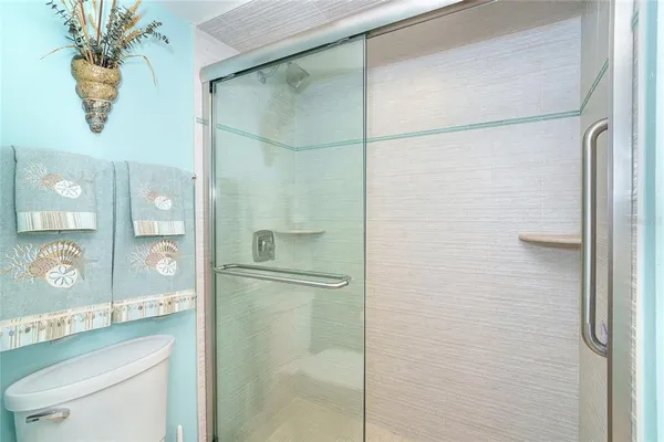 a view of a patio with a dining table and chairs with potted plants and big yard